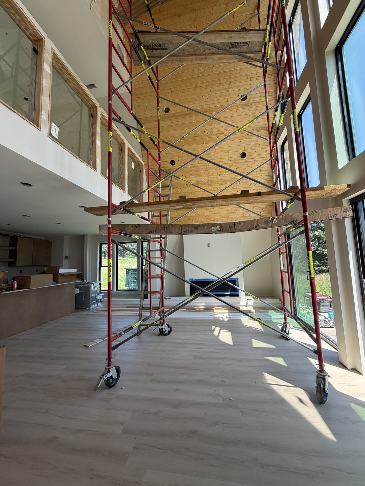 HOM Villas great room with wood wall and plank floors
