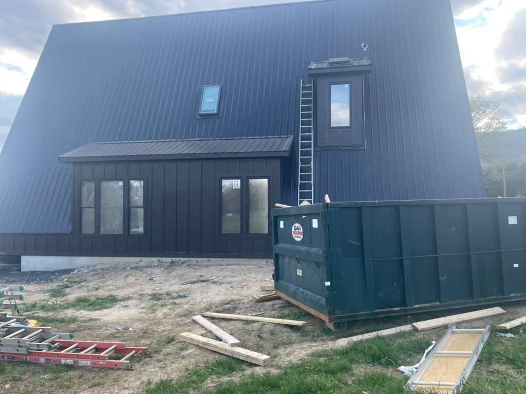 Wide shot of the cabin nearing exterior completion